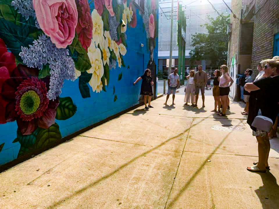 Fort Wayne Food Tours making a stop at a mural in Downtown Fort Wayne.