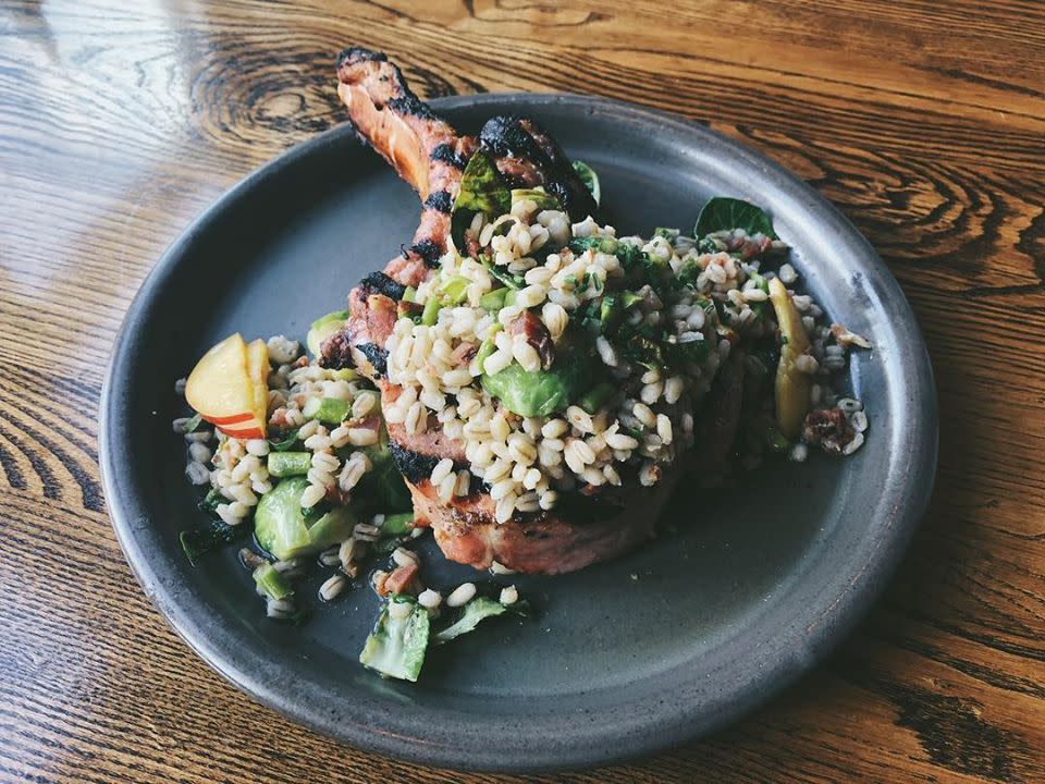 Pork chop with barley, brussels sprouts, and apple at Cerulean Restaurant in Winona Lake