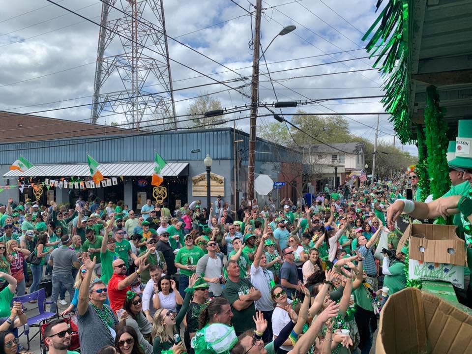 Crowds outside The Brass Monkey in Olde Towne Slidell clamor for throws at the annual St. Patrick's Day parade.