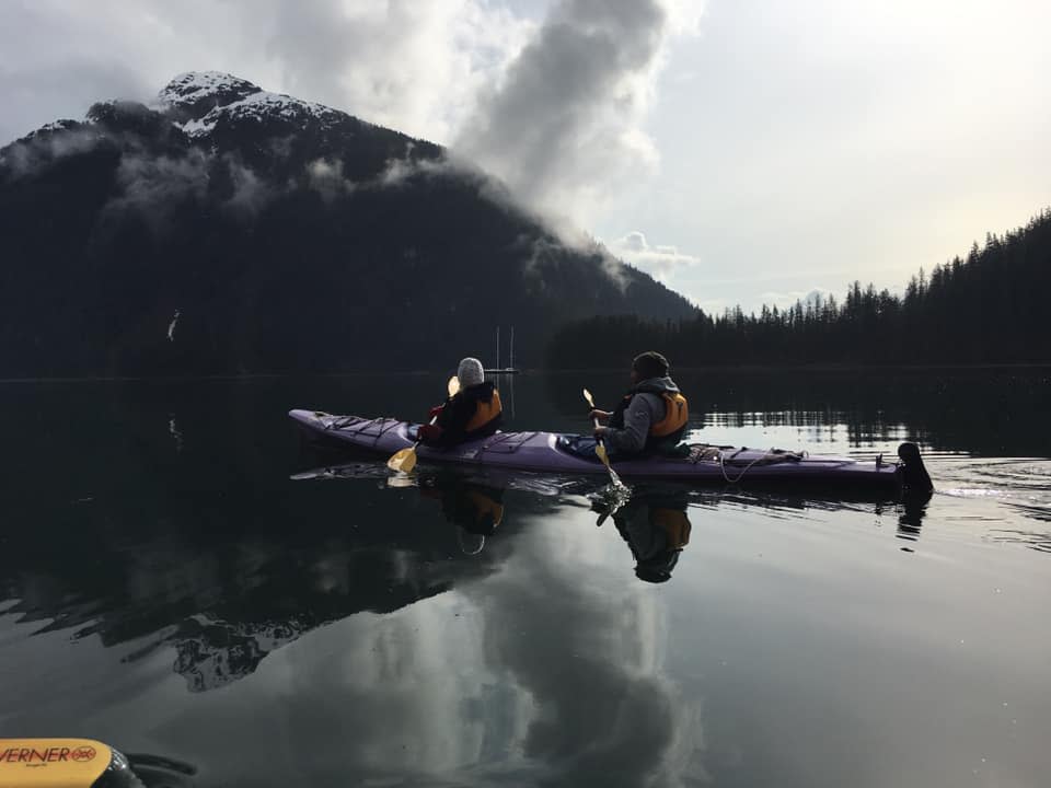 a tandem kayak in a remote bay