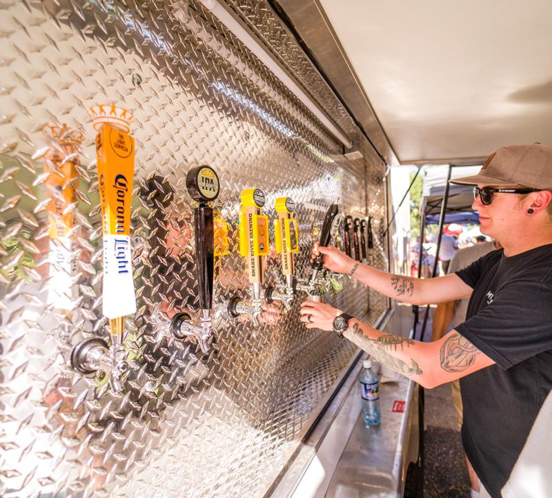 Man Pouring A Beer At A Beer Truck In Casper, Wyoming