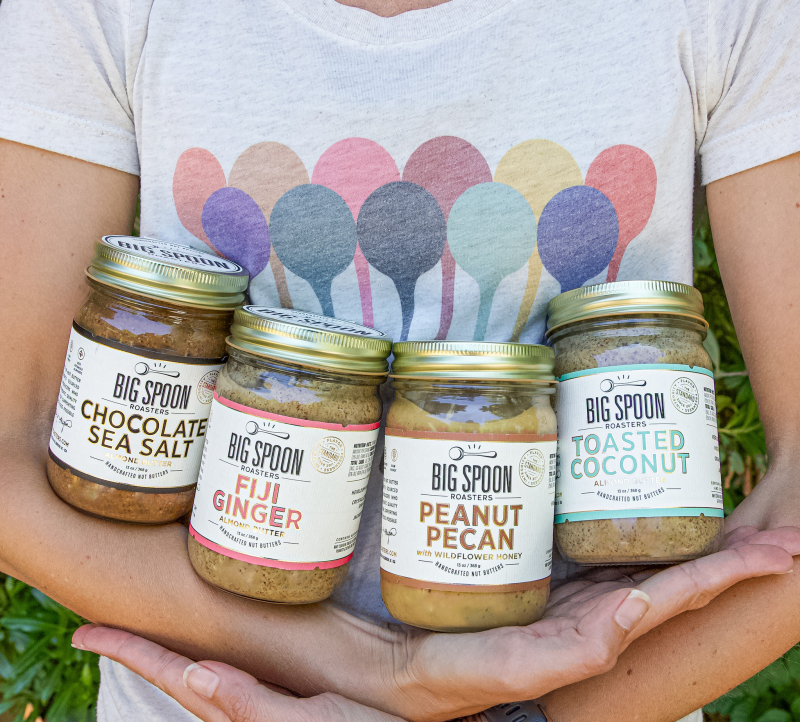 Person Holding 4 Jars of Big Spoon Roasters Nut Butter