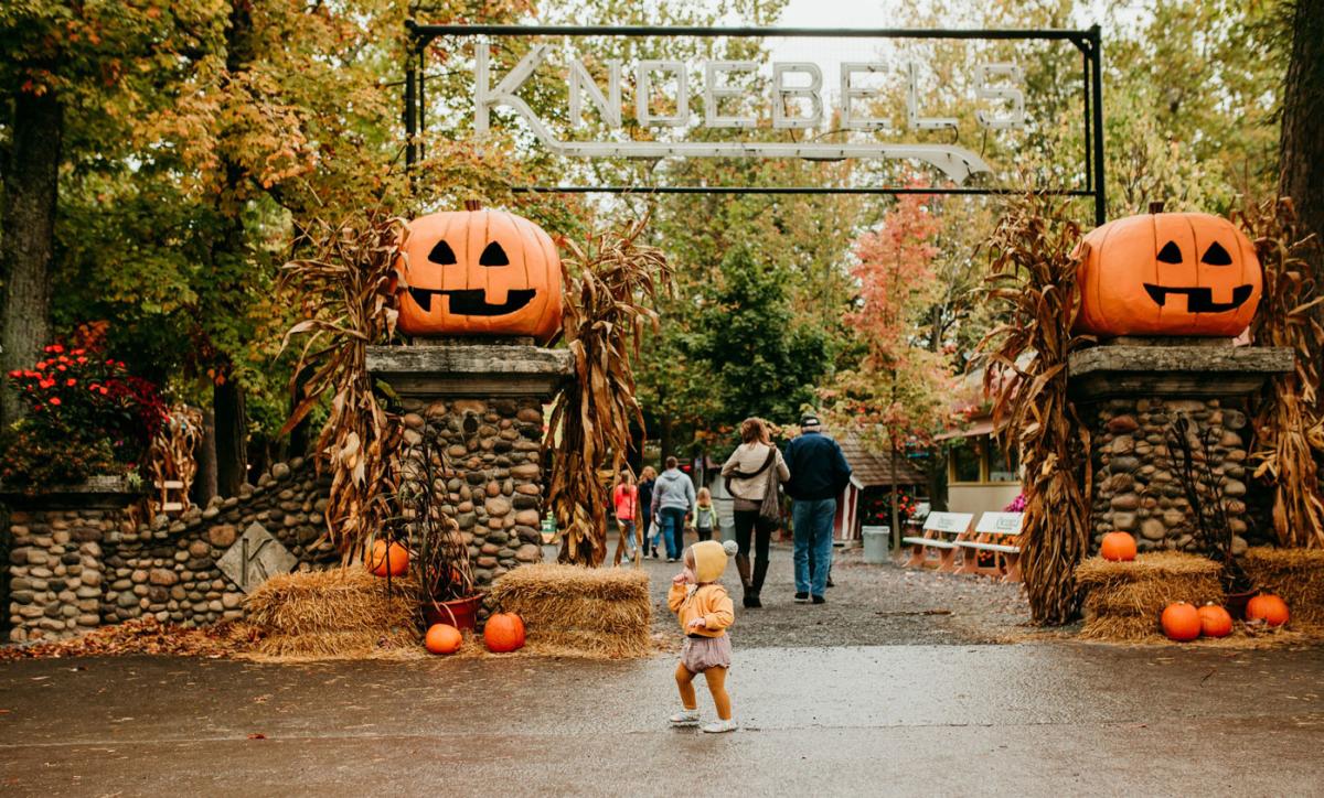 little girl in front of the Knoebels Entrance Arch 