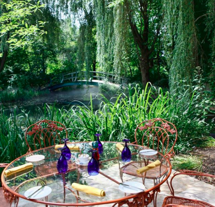 Table near a lake looking out on to a bridge