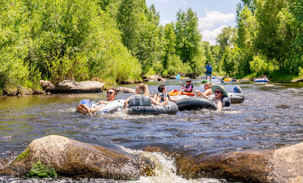 Families enjoy tubing the yampa river through downtown Steamboat Springs