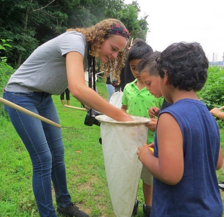 kids enjoying an outdoor activity with bug nets