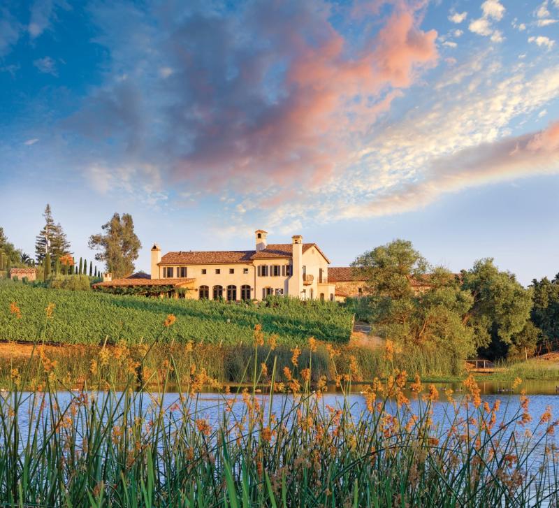 The Tuscan-style Krupp Brothers Winery sits on a grassy slope overlooking Lake Cynthia.