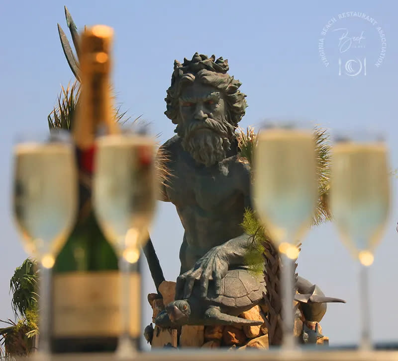drinks out of focus with a statue in the background