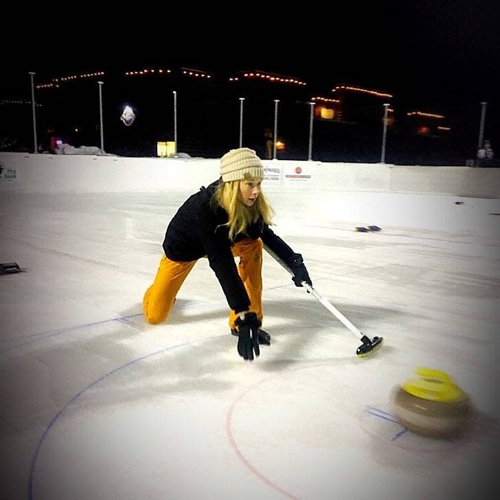 Photo by user rarebirdae, caption reads First night on the ice in town. Trying out my curling skills. #sendit #curling #bigsky #montana