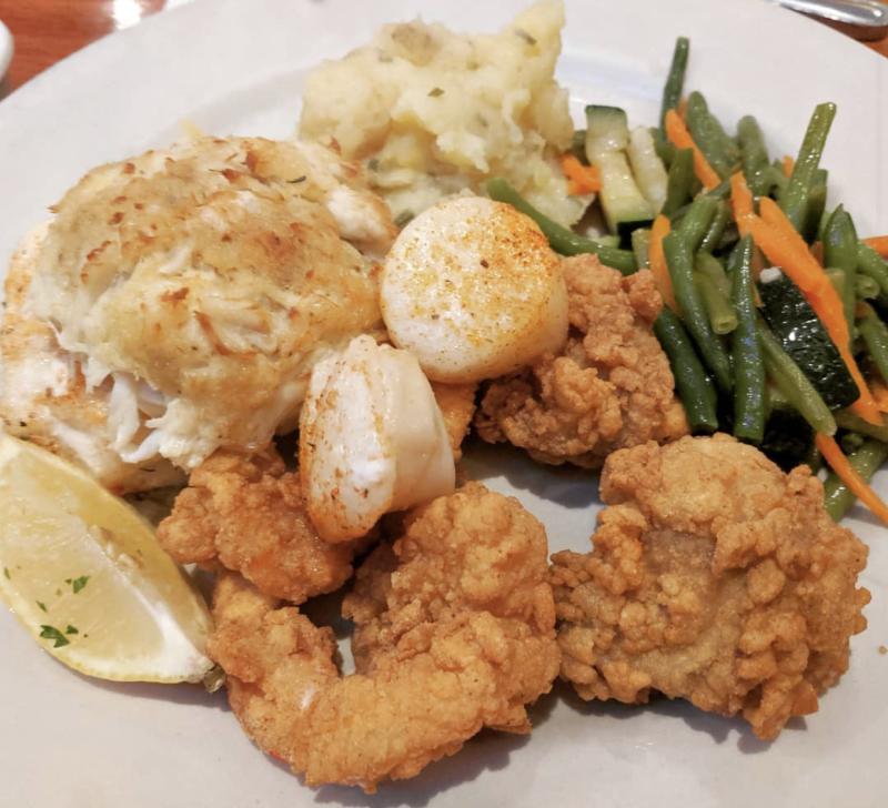 A plate features award-winning tempura shrimp and crab cakes from Blue Seafood