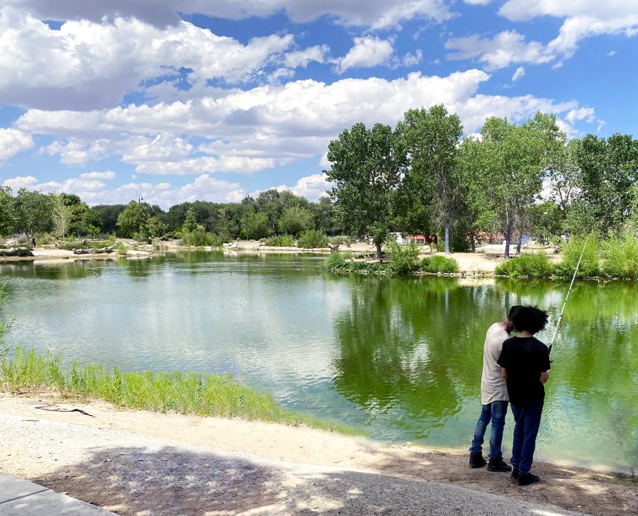 Father and son fishing at Tingley Beach, Albuquerque, New Mexico