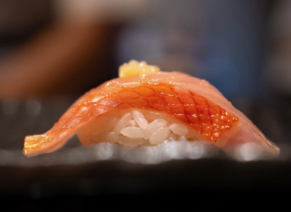 Close up shot of a single piece of nigiri.