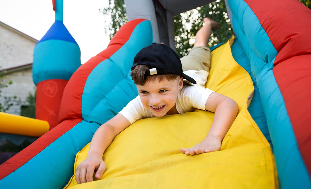 Kid Playing on Slide