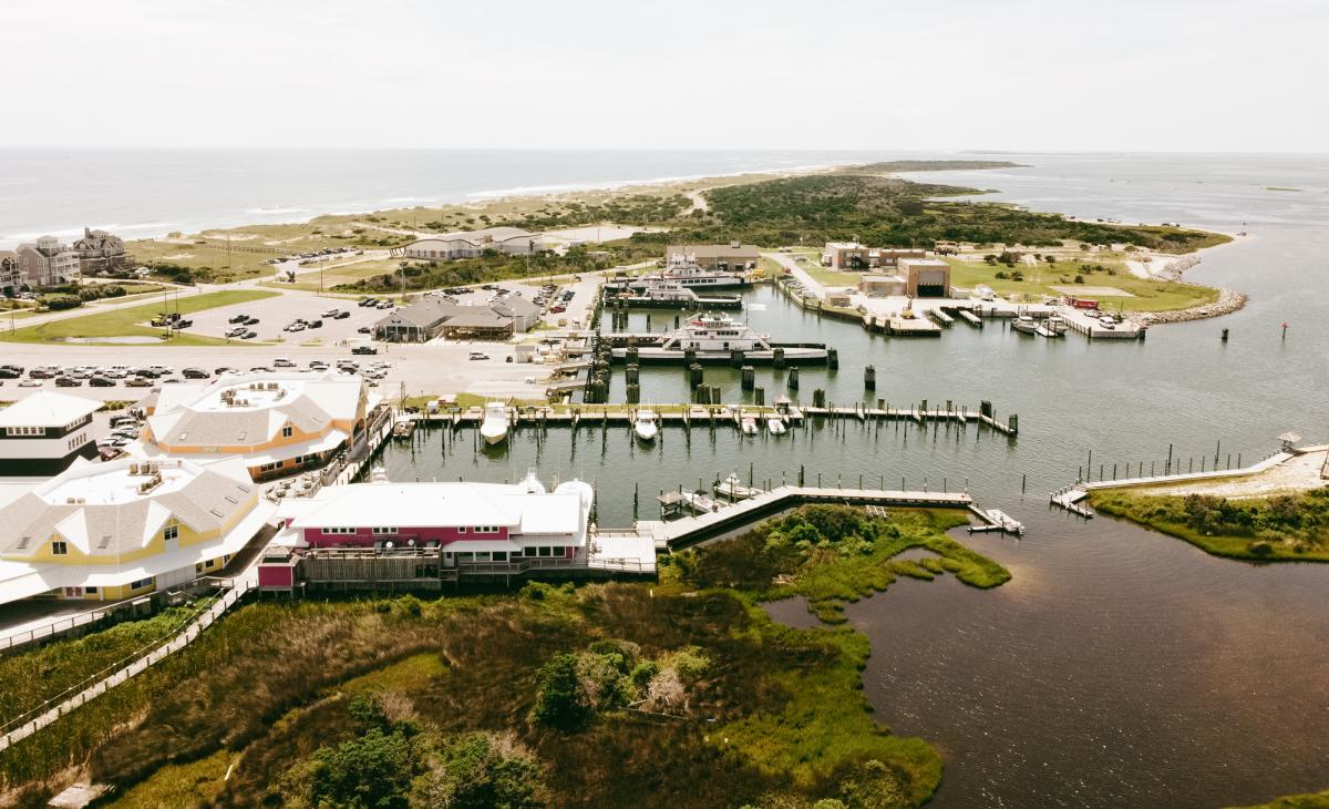 An aerial view of Hatteras Landing Marina, featuring the wooden walkways and docks on Hatteras Island, NC.