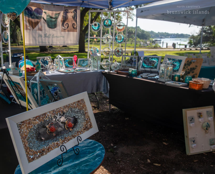 art for sale at an outdoor market in Sunset Beach, NC