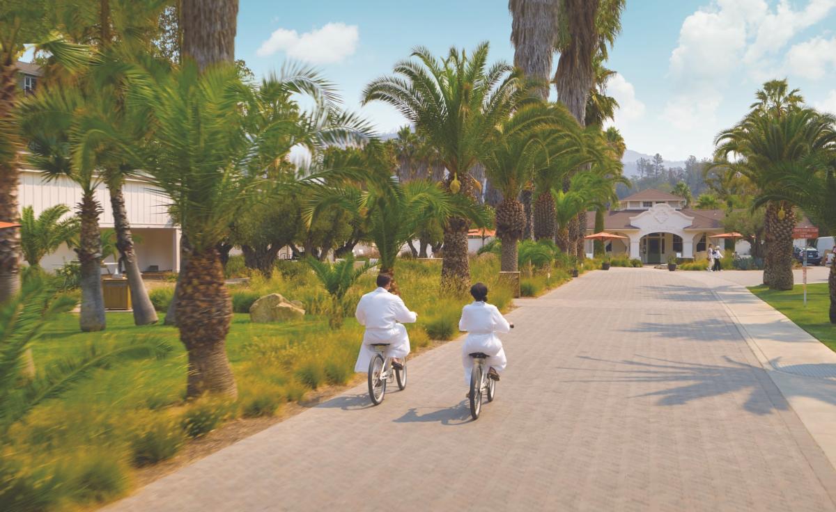 Couple riding biking to the Indian Springs spa