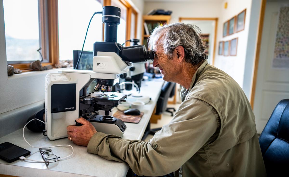 Russ Kleinman inspects one of the many moss species he has collected