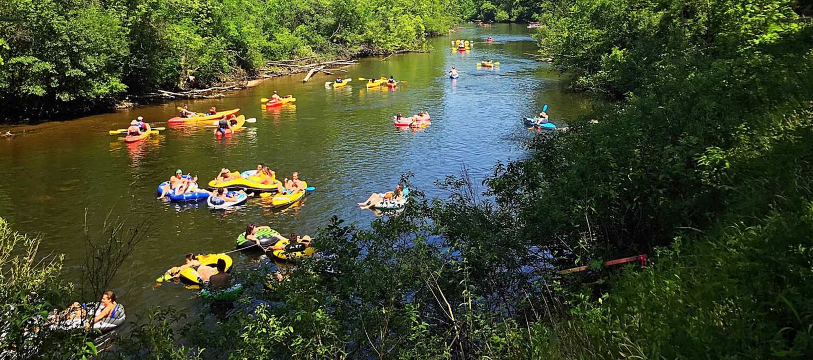 Group of kayakers on Huron River in summer