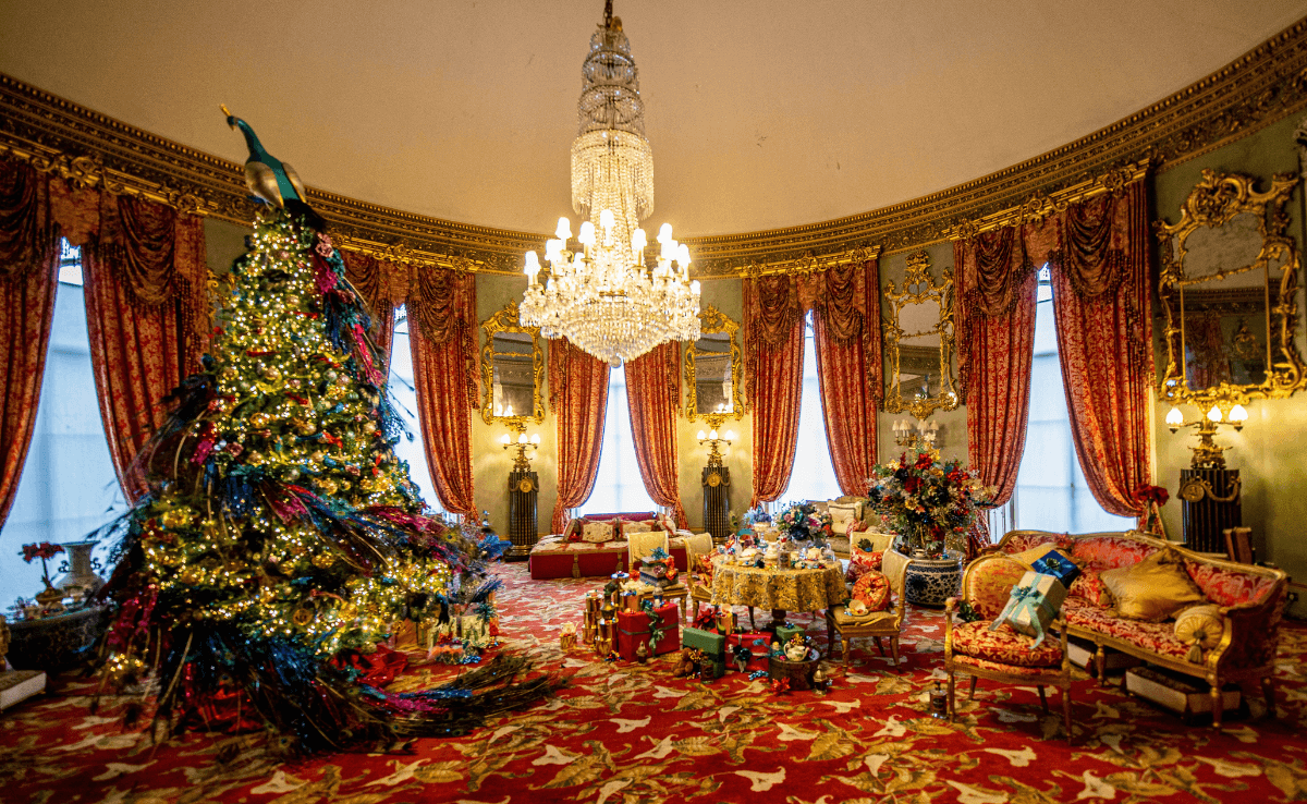 Hallway at Belvoir Castle decorated with a tree and presents on the floor