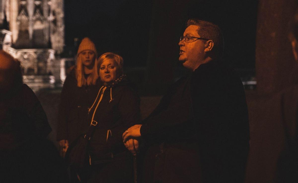 people gathered together for a Ghost Walk event late at night