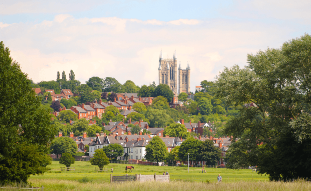 a view of the park and houses within West Common