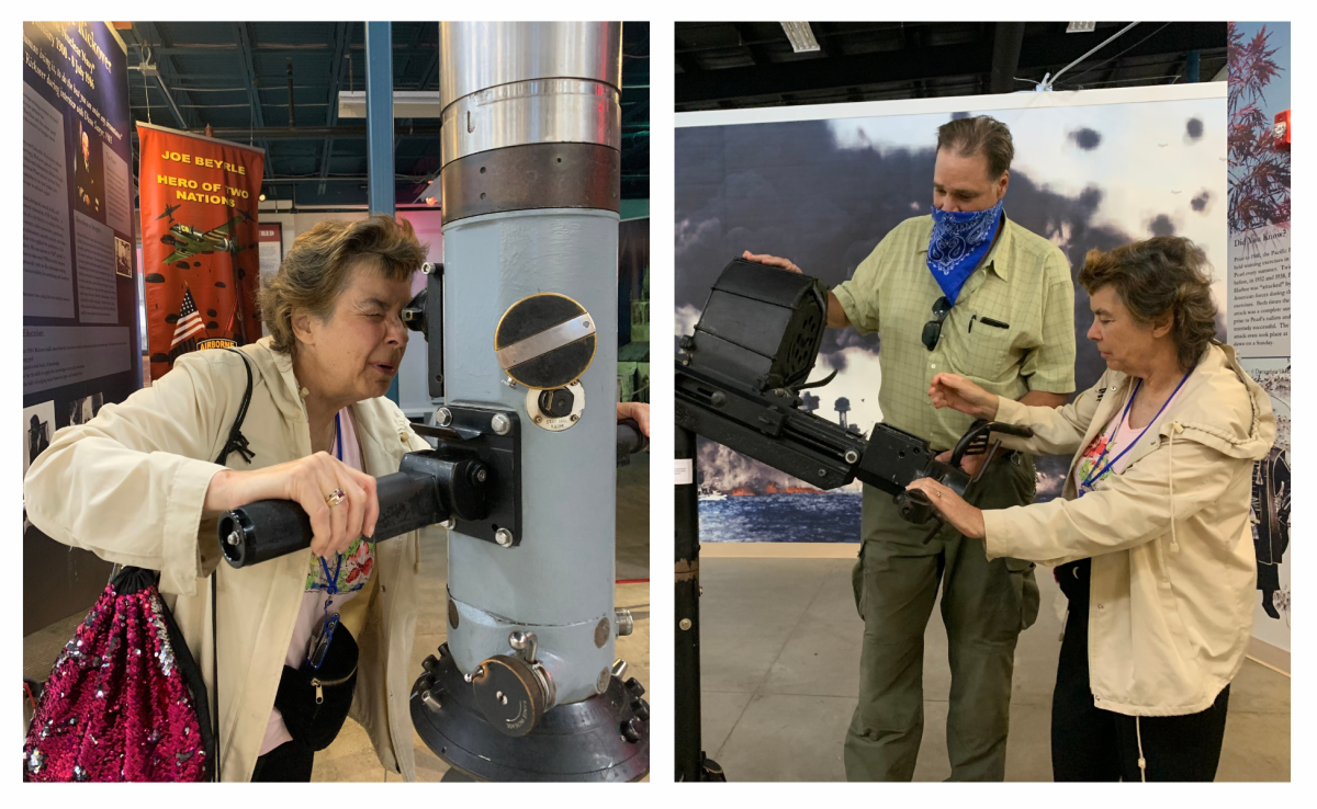 Two individuals interacting with naval exhibits at a museum, examining equipment and discussing its features.