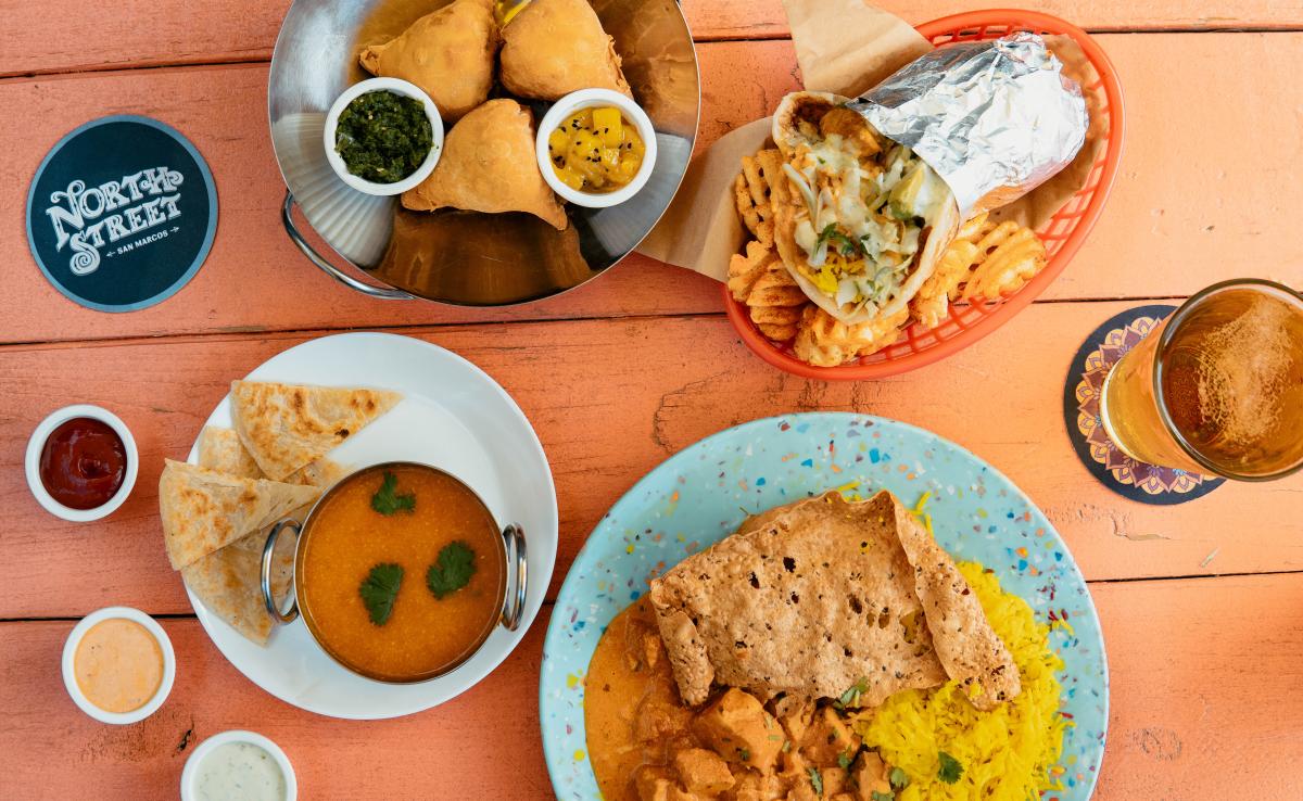A brightly colored table full of delicious food from North Street in Downtown San Marcos, Texas