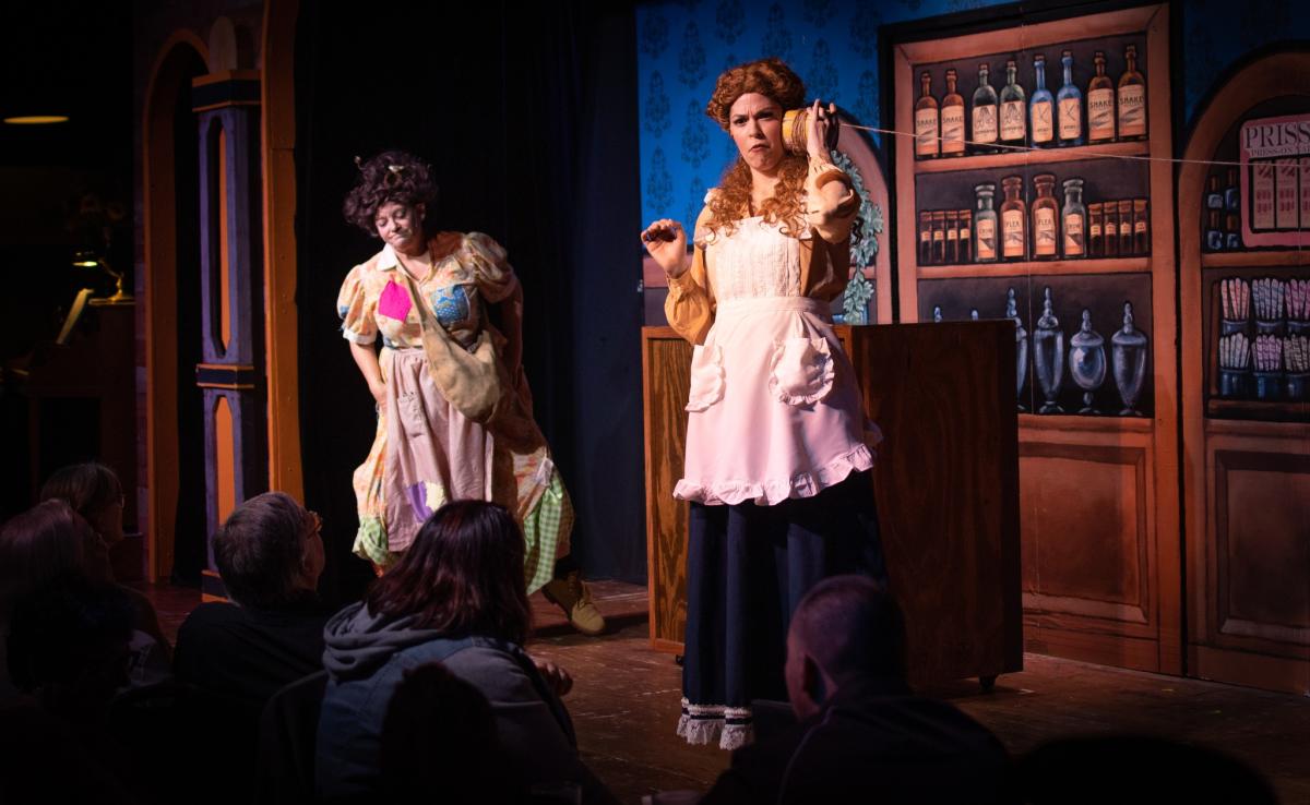 The cast of Hard Times at Mary Jane's Mercantile performs on stage at Mosley Street Melodrama