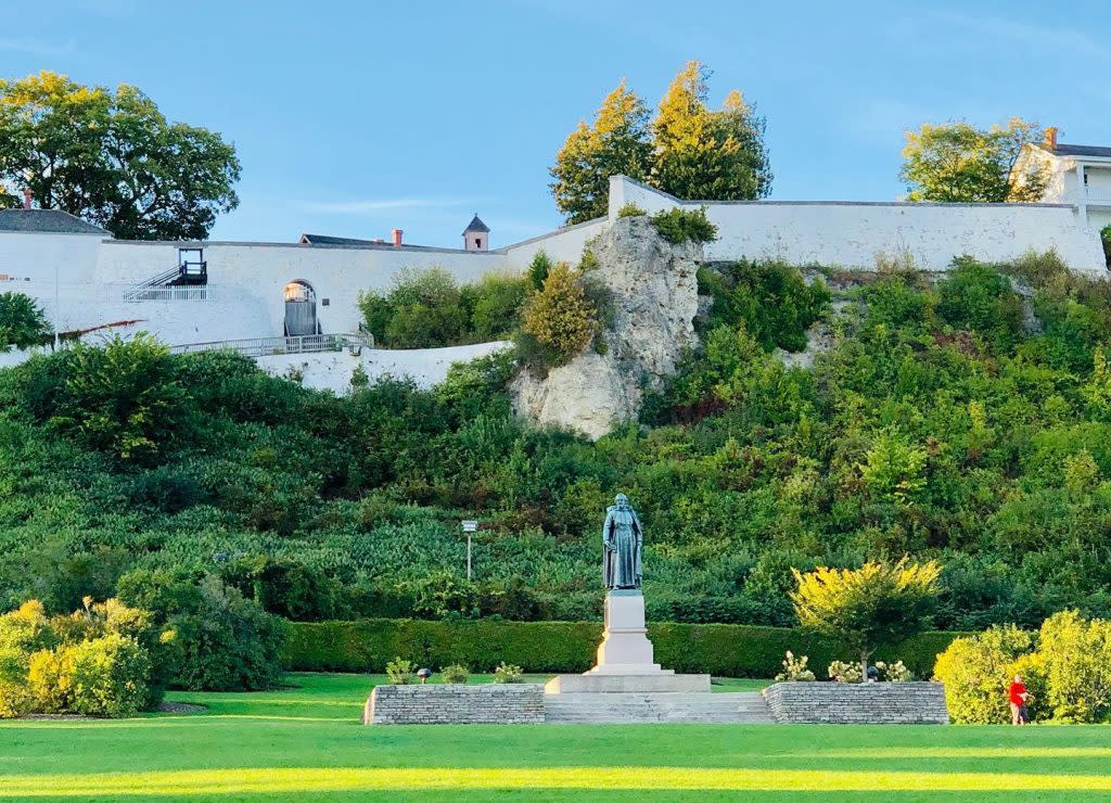 A statue of Father Jacques Marquette stands in Mackinac Island's Marquette Park at the foot of Fort Mackinac