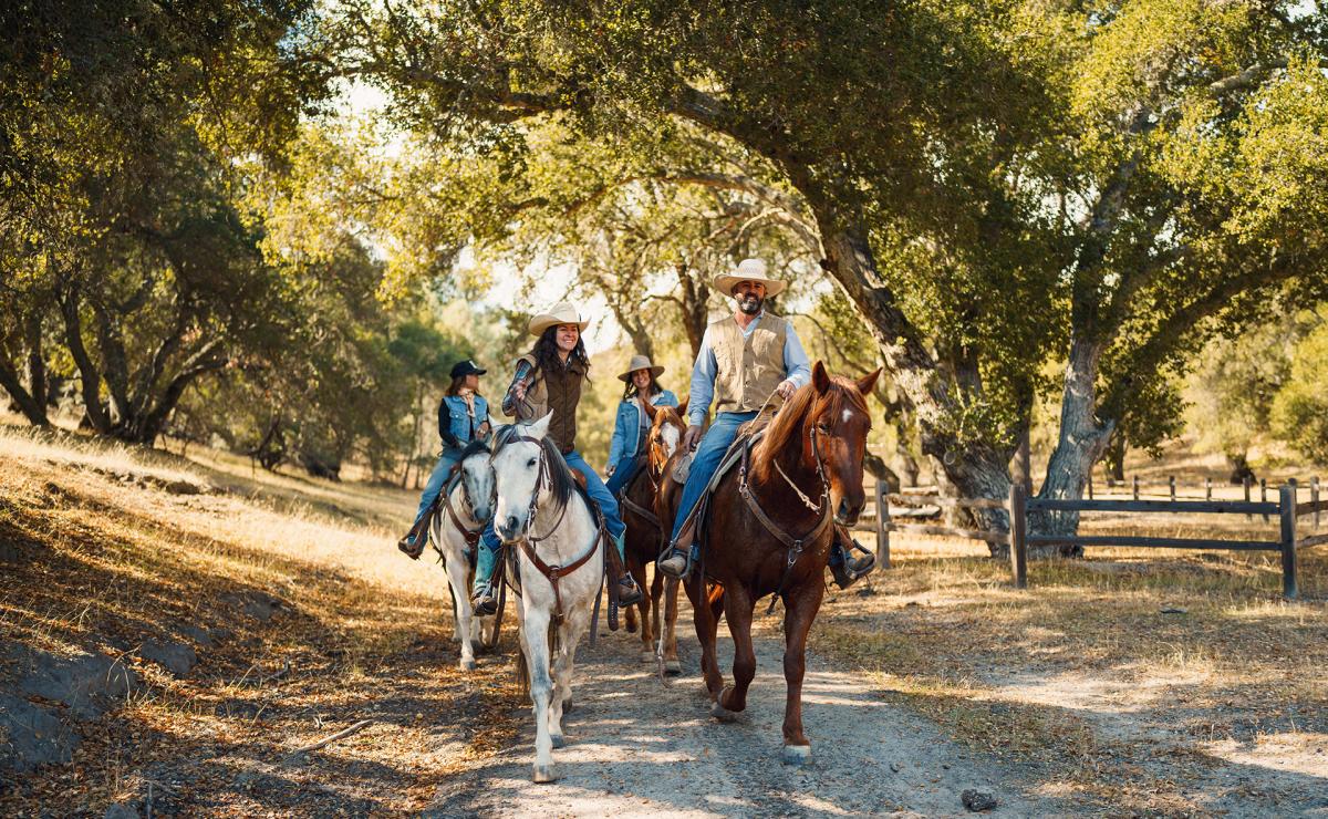 group horseback riding on a trail in Santa Margarita