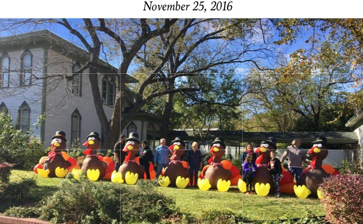 Families posing on Church Street with their inflatable turkeys in November 2016
