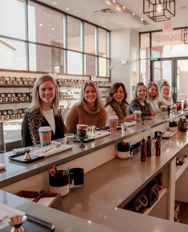 Women at the blending bar at Olfactory Scent Studio