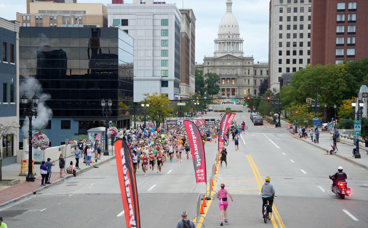 Capital City River Run in downtown Lansing with a view of the state capitol in the background.