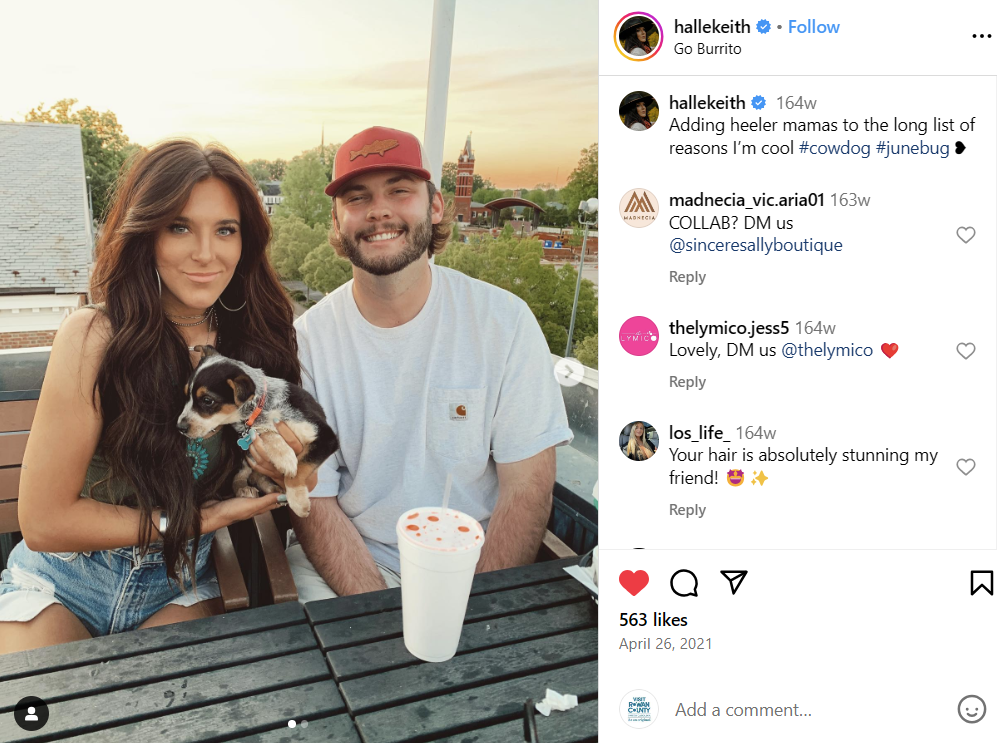 Couple with dog on rooftop of restaurant