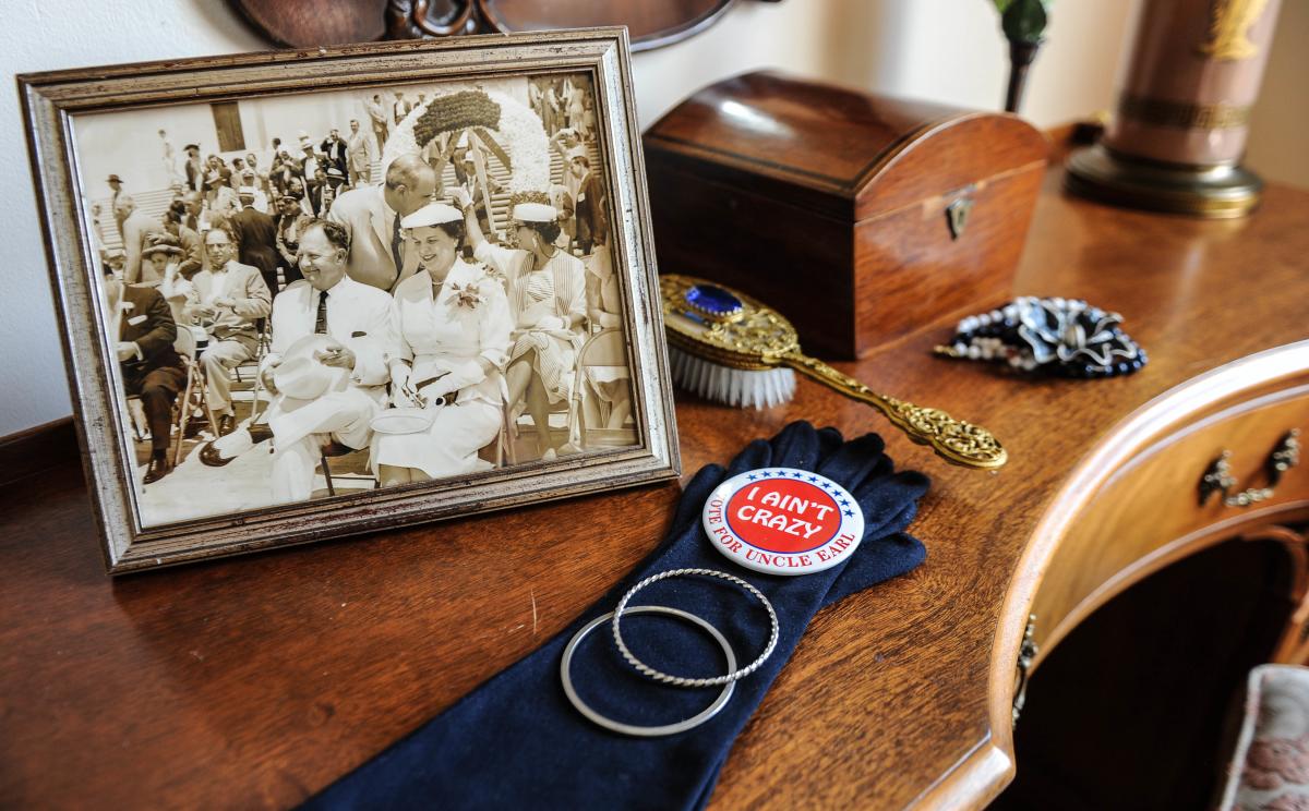 Display of historic photo and items on desk in the Old Governor's Mansion