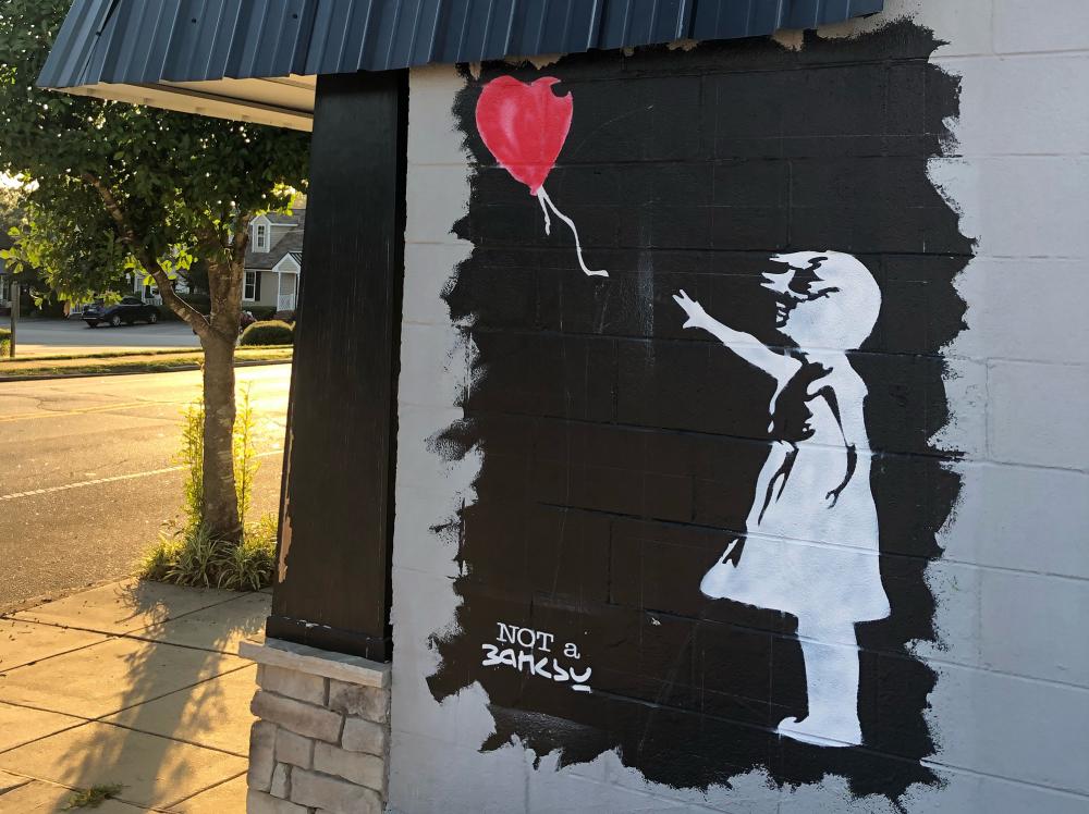Not a Banksy mural in Clayton of a child letting go of a balloon