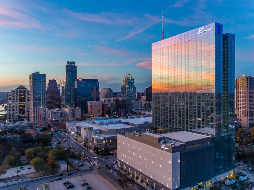 Downtown Austin Texas skyline at sunset with the Fairmont Hotel in foreground