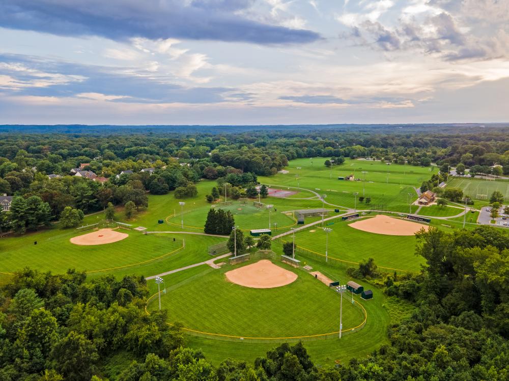 a trio of baseball fields at a park
