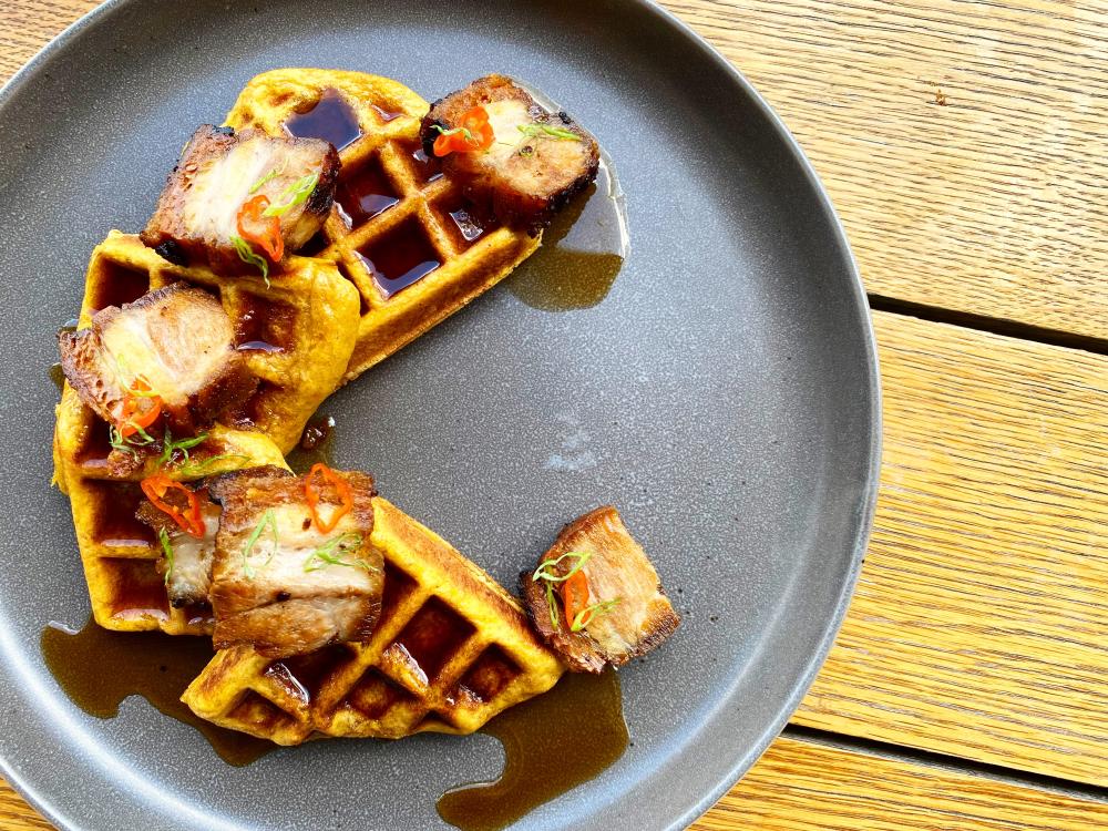 Deconstructed waffle with syrup at Biru Cocina Peruana restaurant