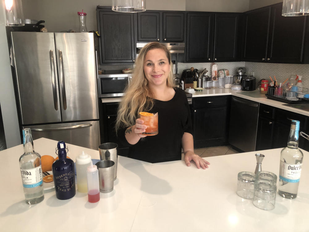 Bartender Caitlin Smith of ATX Cocina makes a cocktail at home