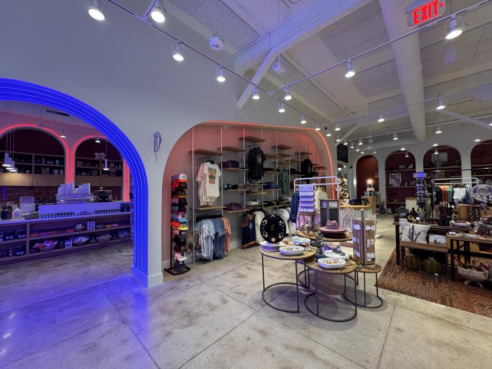 Austin Visitor Center retail space with displays and neon lights.
