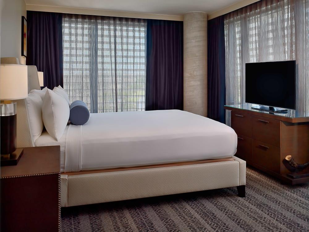 Hotel guest room with king size bed.