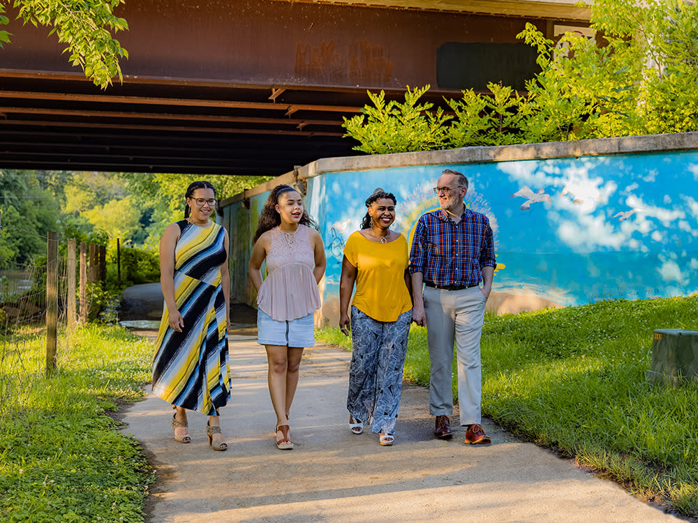 Family walking on 3-mile Buffalo Creek Greenway in Smithfield, NC.