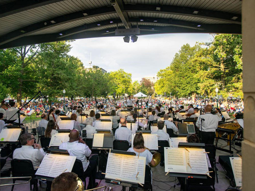 An orchestra performs at the amphitheatre in Bronson Park during the Concerts in the Park summer series.