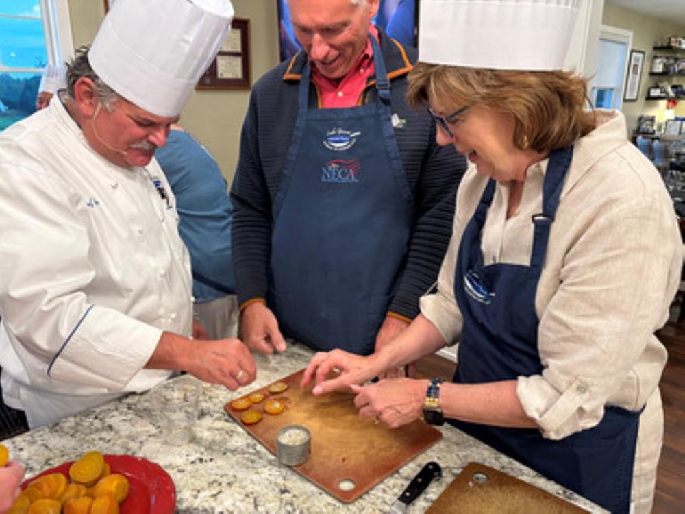 Group taking a cooking class at the Lake Geneva School of Cooking.