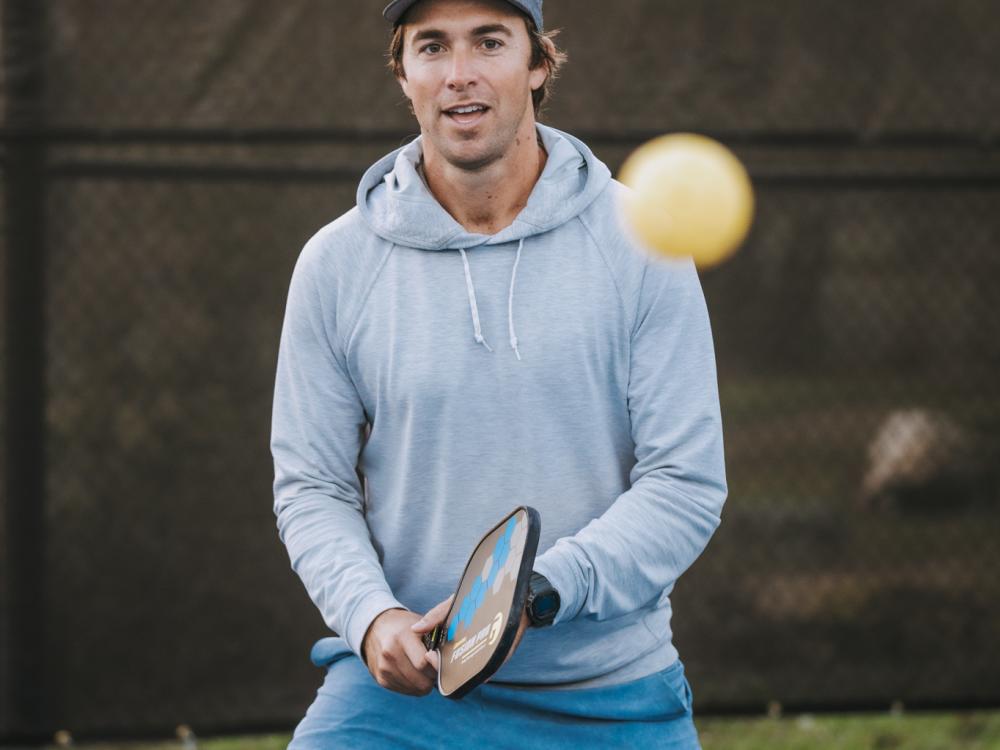 A man playing pickleball