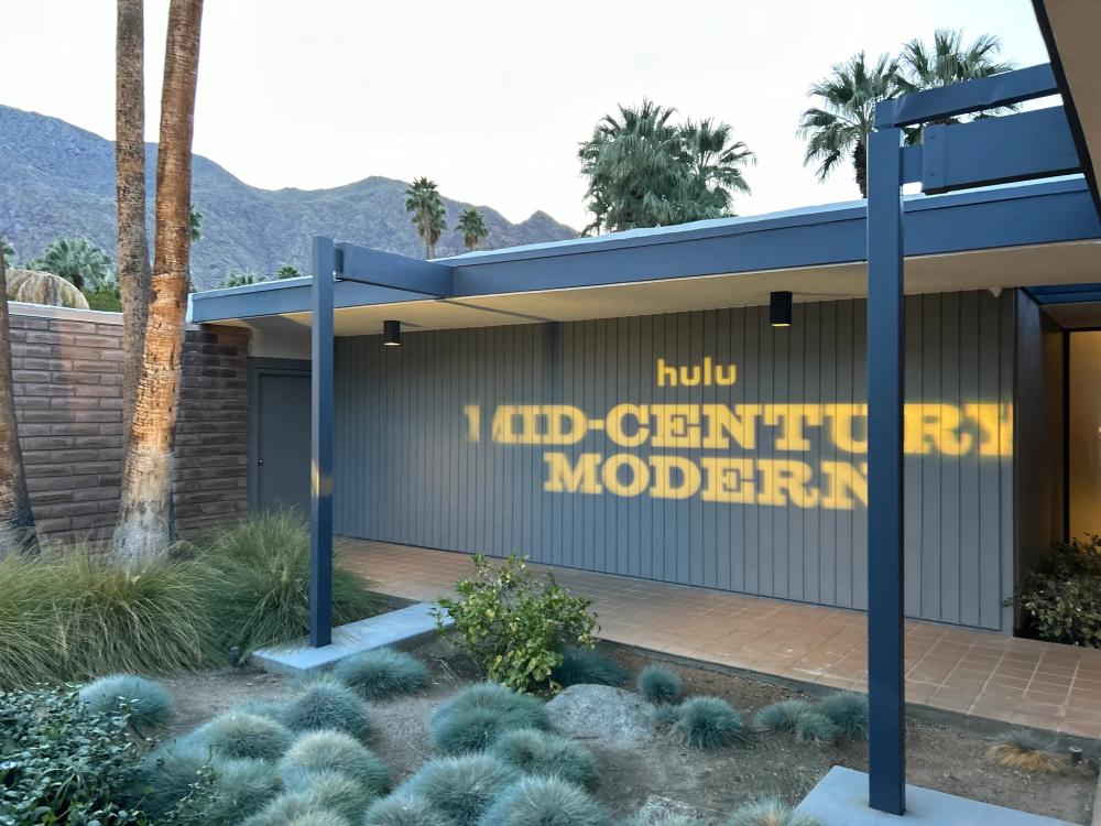 Gobo light of mid-century modern TV show logo on Dinah Shore Estate entry wall.