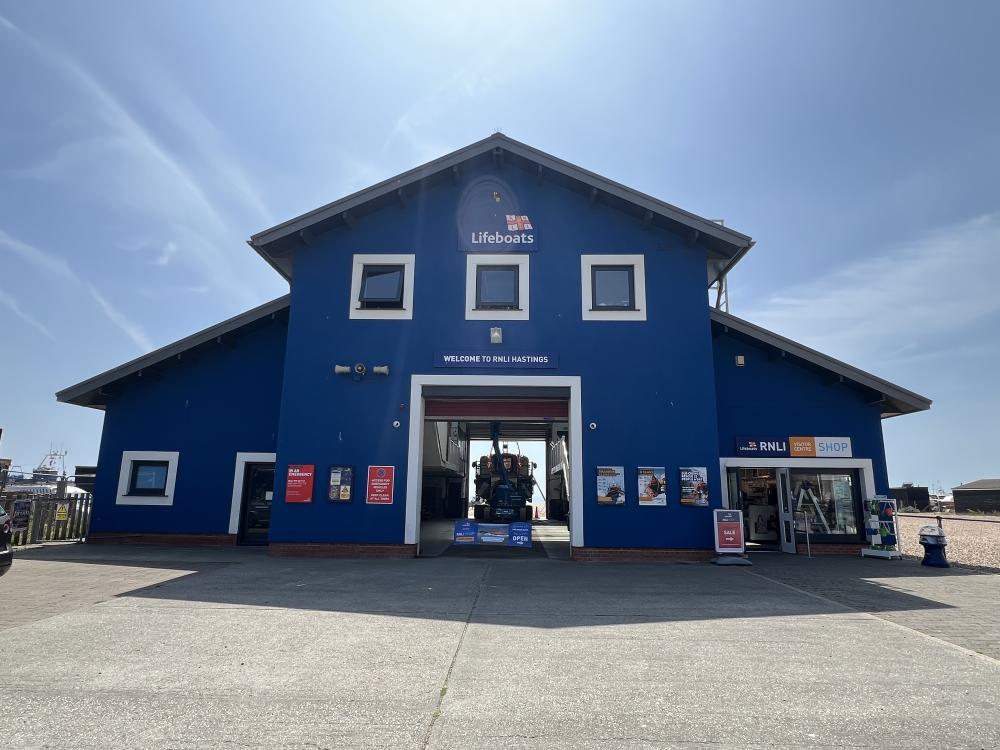 Hastings Lifeboat Station - a large blue building with a lifeboat visible in centre