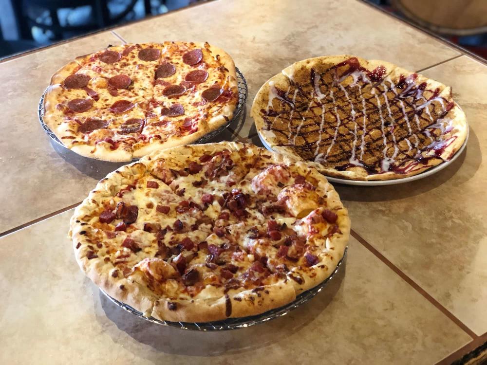 Three Pizzas from Wichita Brewing Co and Pizzeria