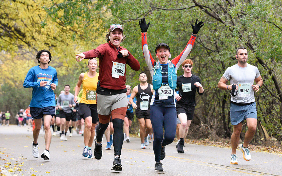 Group of runners showing excitement during the Madison Marathon